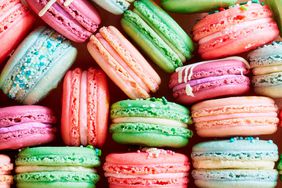 Colorful macarons stacked so filling is visible