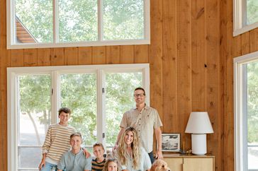 family portrait in vaulted ceiling living room